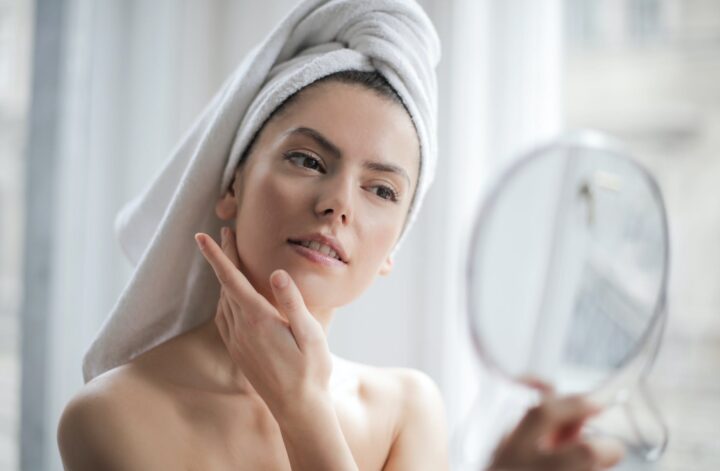 a girls' glowing skin and natural appearance while she smiles and poses