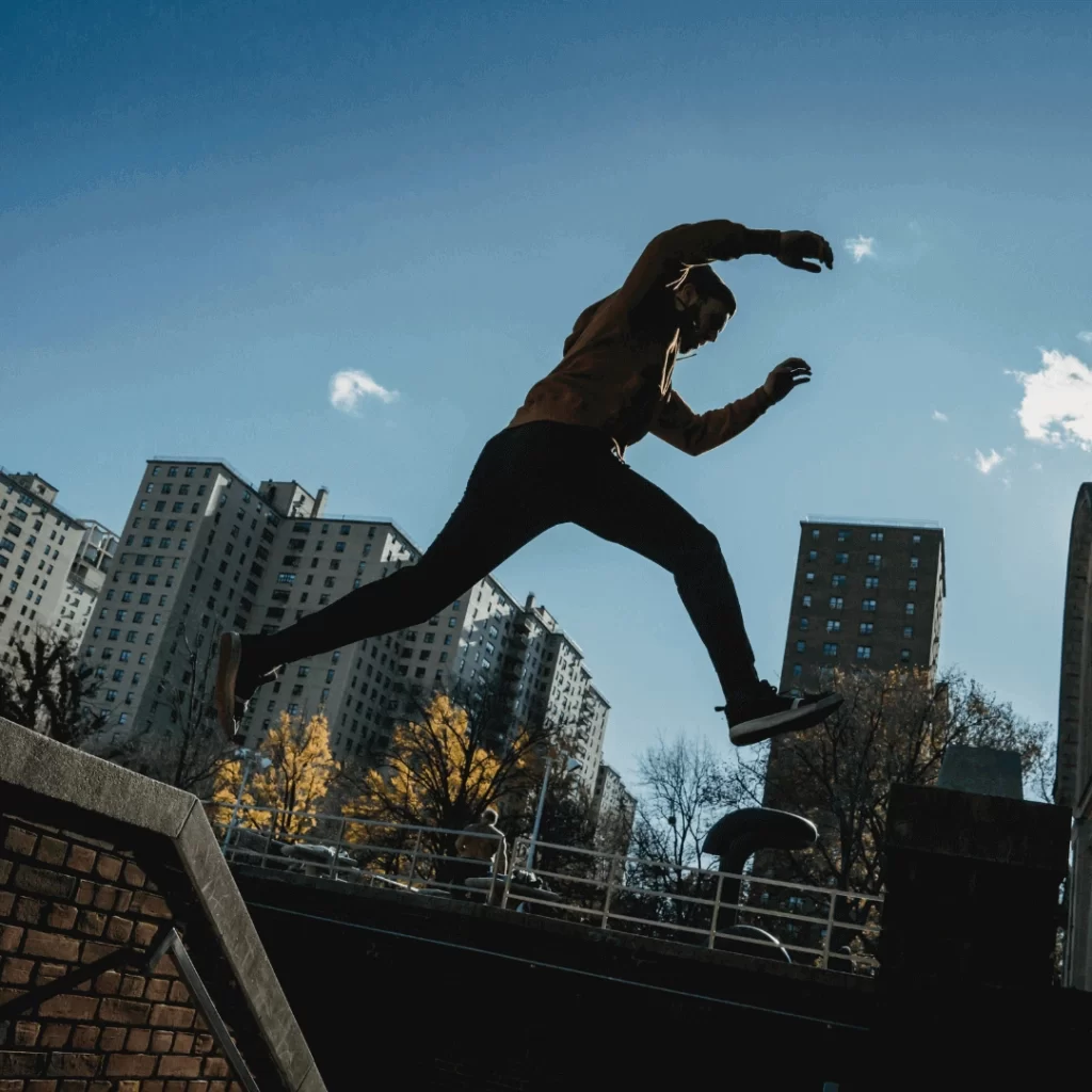 boy jumping from wall