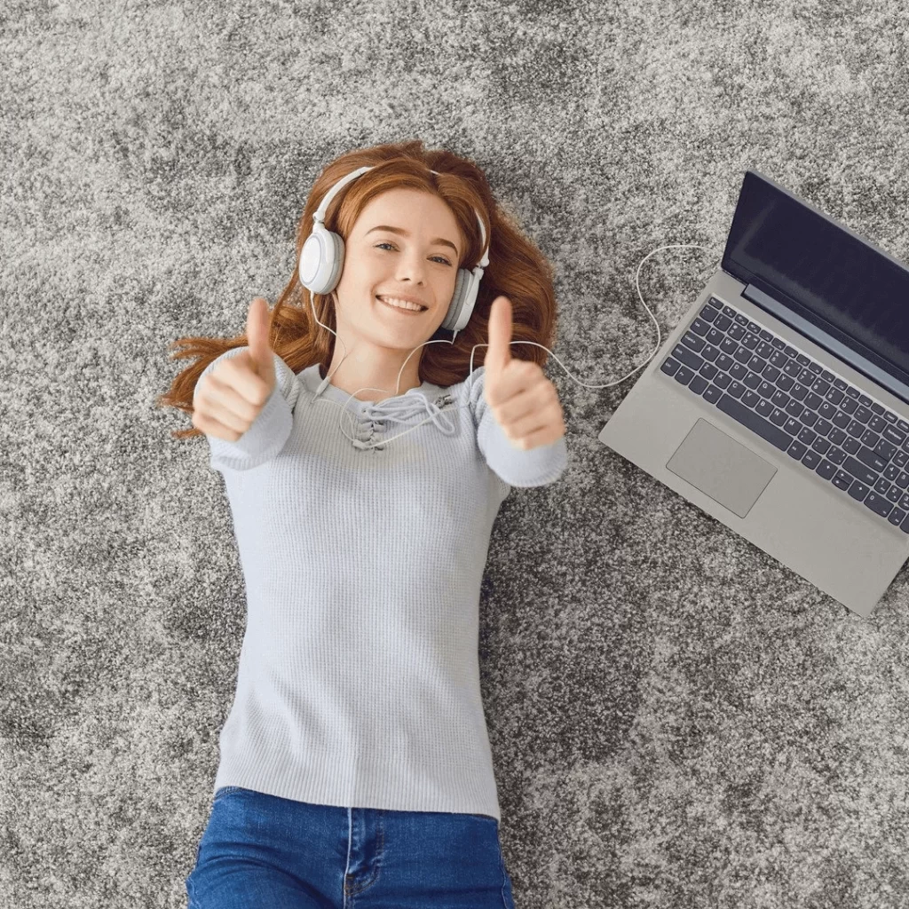 Girl lying on plane listening music