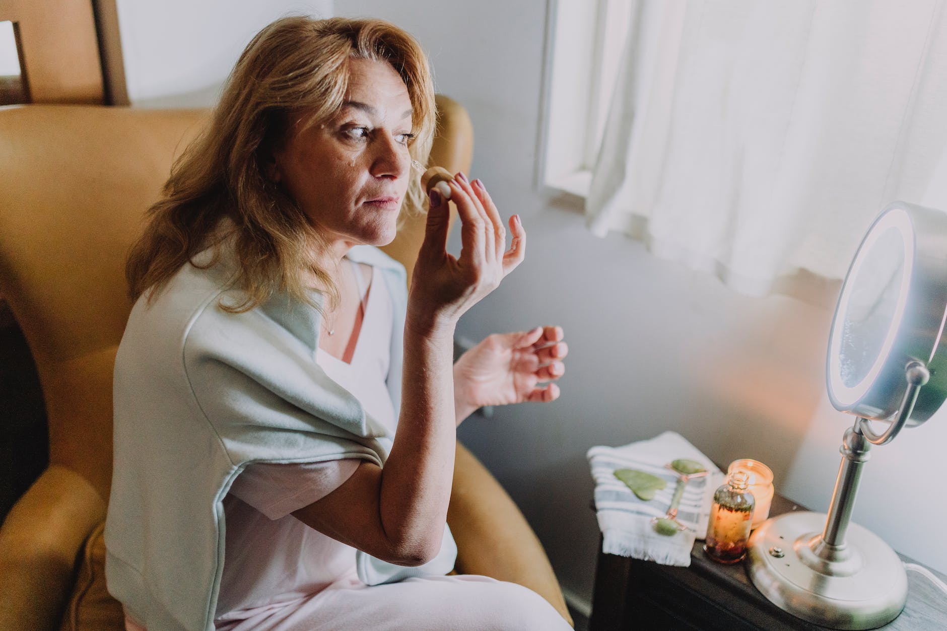 healthy dawn nature fashion with woman applying toner