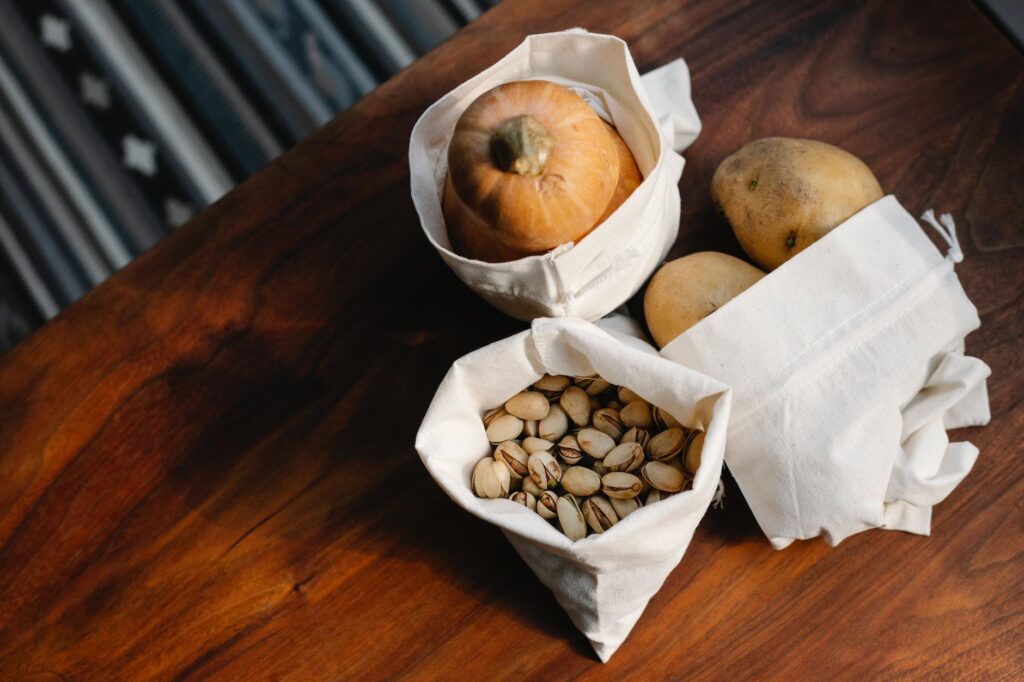 white sacks with vegetables and nuts