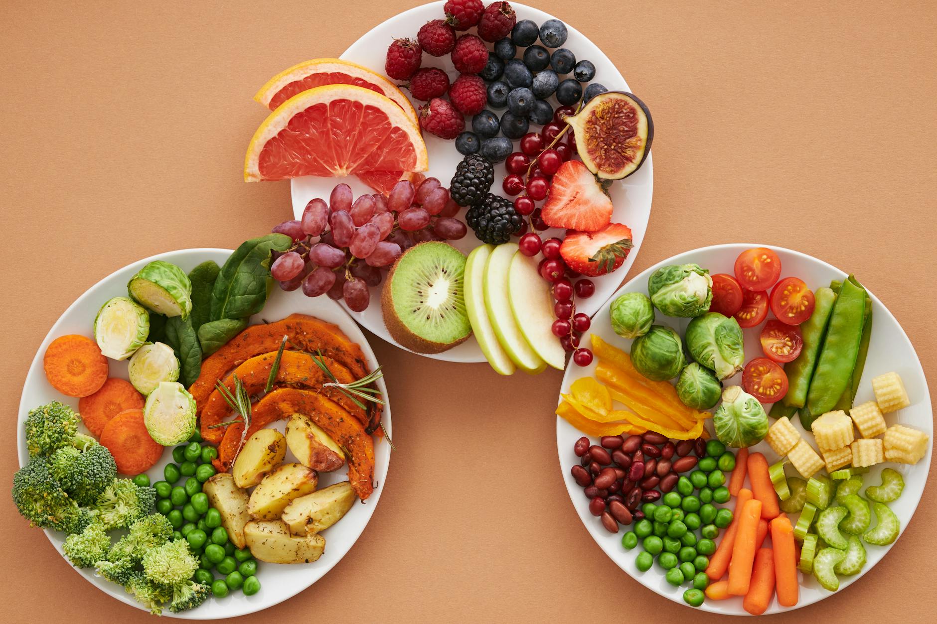top view of plates full of fruits and vegetables